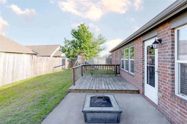 view of patio / terrace featuring a fenced backyard, an outdoor fire pit, and a wooden deck