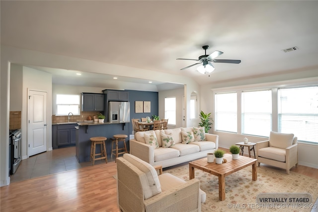 13323 S 21st St, Bixby, OK 74008 - living room with light wood-style floors, a ceiling fan, recessed lighting, and baseboards
