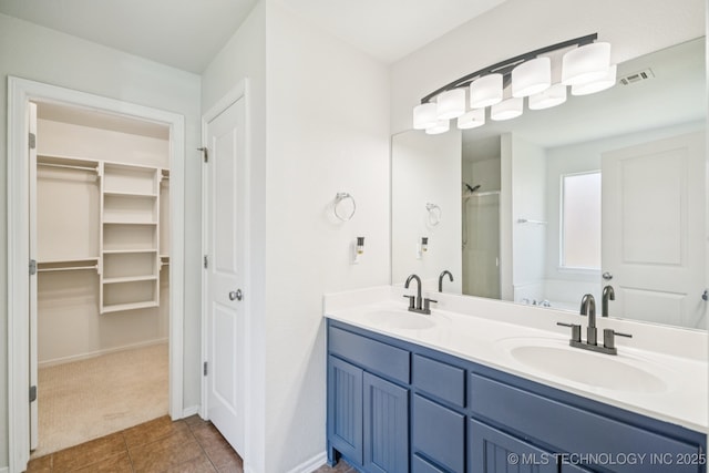 13323 S 21st St, Bixby, OK 74008 - bathroom with double vanity, a spacious closet, tile patterned floors, and a shower