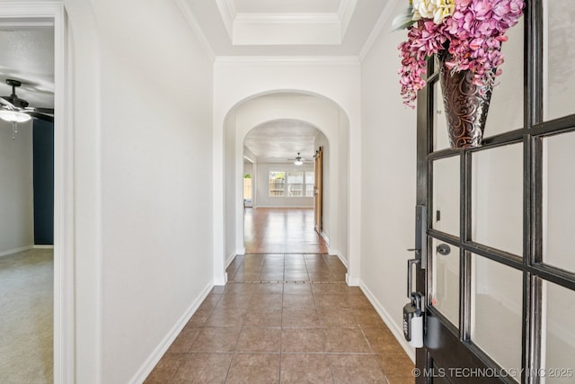 13323 S 21st St, Bixby, OK 74008 - corridor featuring arched walkways, a raised ceiling, crown molding, and tile patterned floors