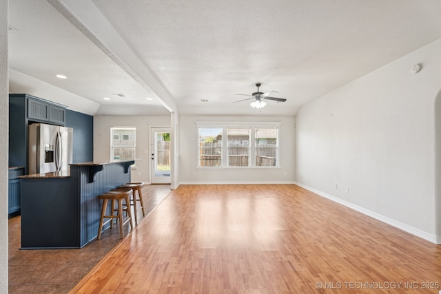 13323 S 21st St, Bixby, OK 74008 - living room featuring a ceiling fan, light wood-type flooring, and recessed lighting