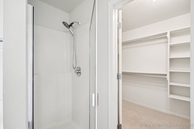 13323 S 21st St, Bixby, OK 74008 - bathroom featuring a shower stall and a spacious closet