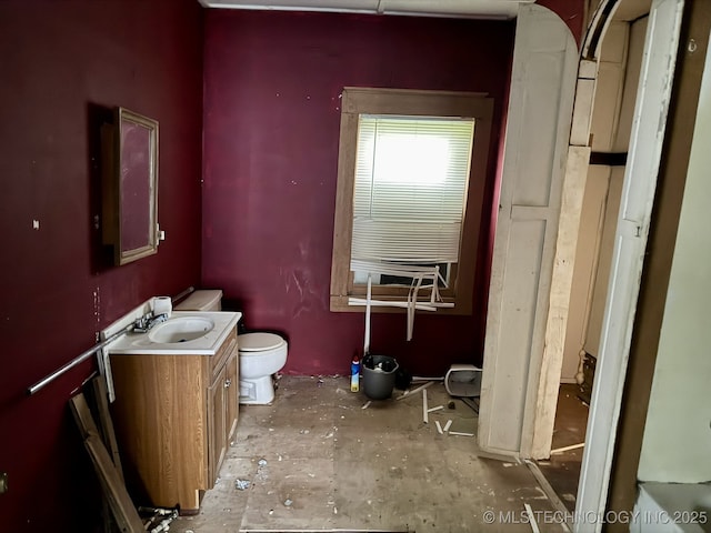 bathroom featuring toilet and vanity