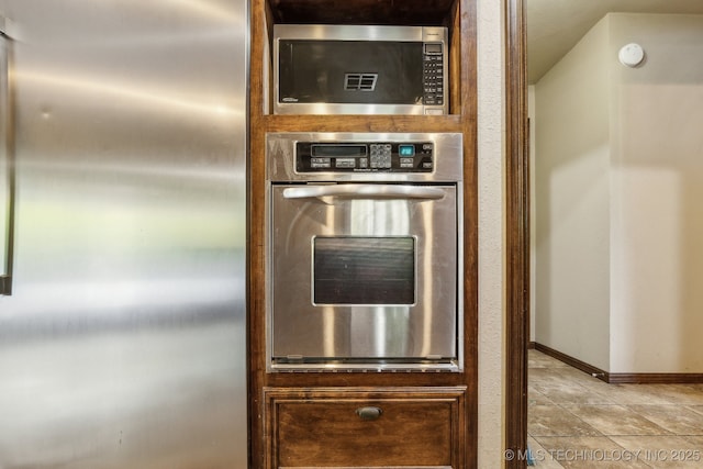 5601 S 9th E, Muskogee, OK 74403 - details with baseboards and appliances with stainless steel finishes