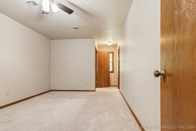 5601 S 9th E, Muskogee, OK 74403 - empty room featuring baseboards, visible vents, ceiling fan, and light colored carpet