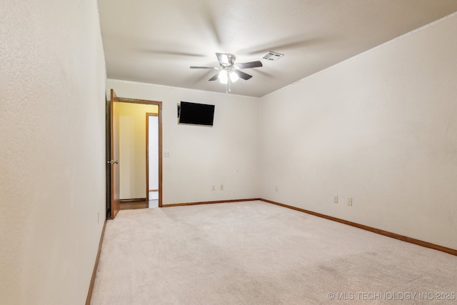 5601 S 9th E, Muskogee, OK 74403 - spare room featuring a ceiling fan, visible vents, light colored carpet, and baseboards