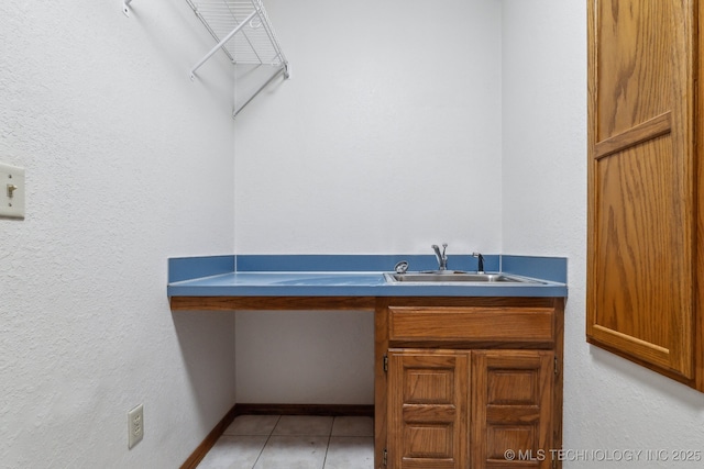 5601 S 9th E, Muskogee, OK 74403 - bathroom featuring tile patterned floors, vanity, and baseboards