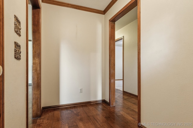 5601 S 9th E, Muskogee, OK 74403 - corridor with dark wood finished floors, baseboards, and crown molding