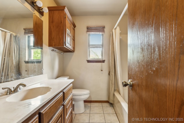 5601 S 9th E, Muskogee, OK 74403 - bathroom featuring shower / bathtub combination with curtain, vanity, tile patterned floors, toilet, and baseboards