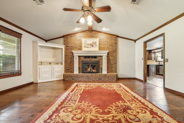 5601 S 9th E, Muskogee, OK 74403 - unfurnished living room with a fireplace, visible vents, ceiling fan, and wood-type flooring