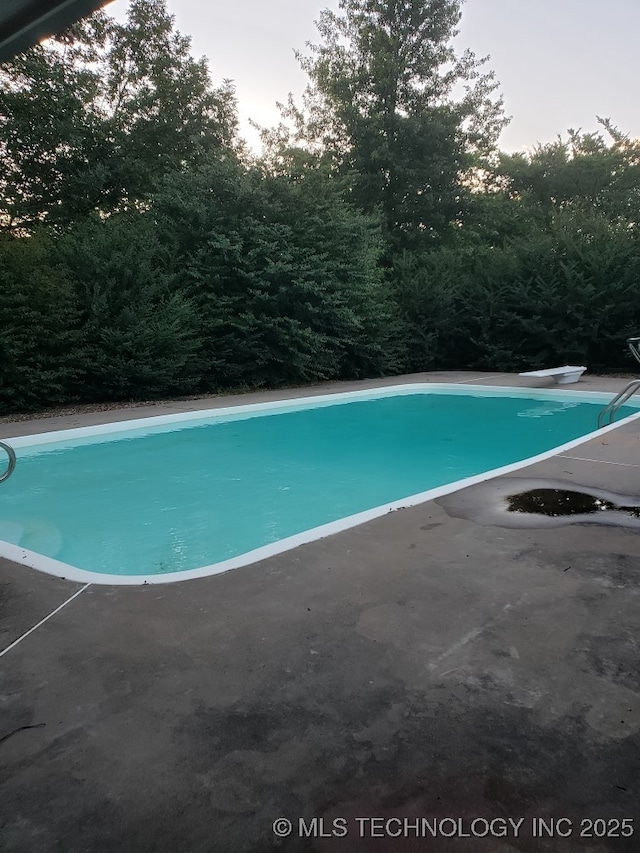 5601 S 9th E, Muskogee, OK 74403 - outdoor pool featuring a patio area and a diving board