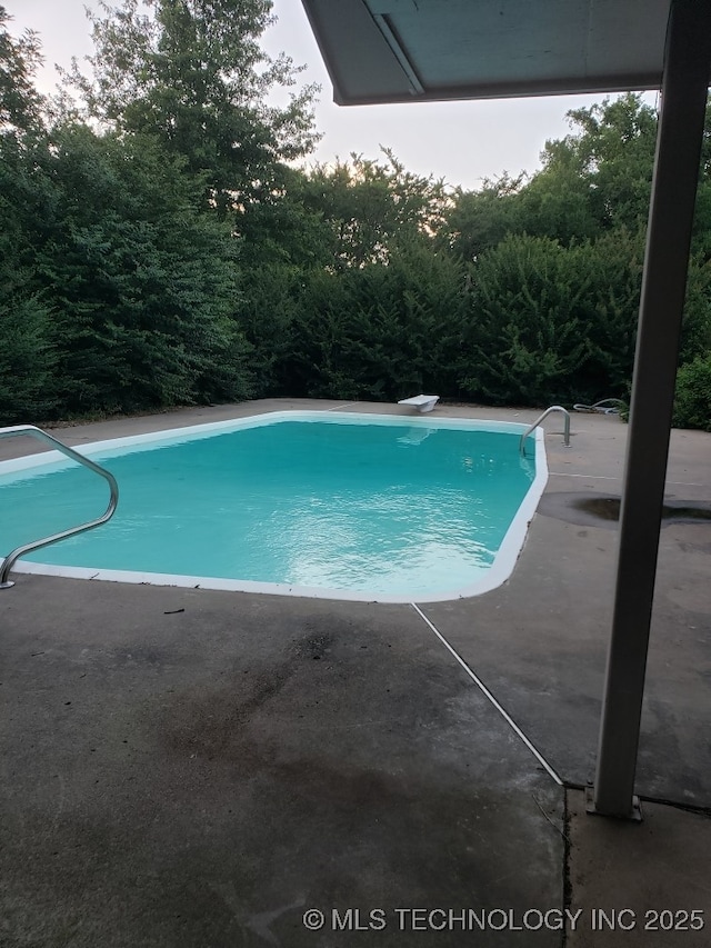 5601 S 9th E, Muskogee, OK 74403 - swimming pool featuring a patio area and a diving board