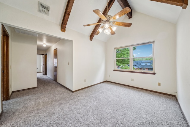 carpeted empty room with baseboards, visible vents, beamed ceiling, and ceiling fan