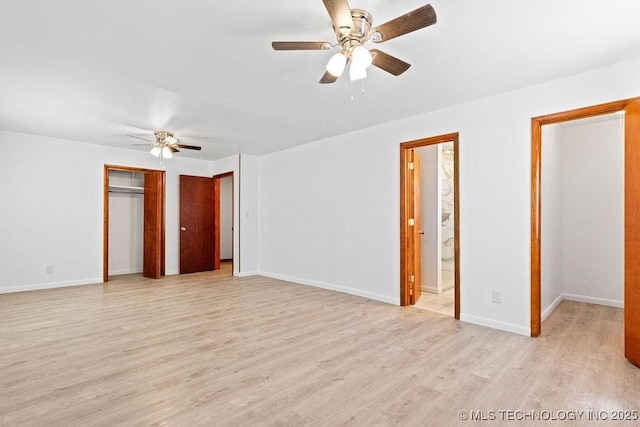 unfurnished bedroom featuring connected bathroom, a ceiling fan, light wood-style flooring, and baseboards