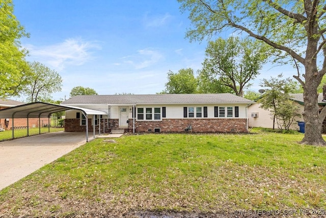 single story home featuring a front yard, a detached carport, concrete driveway, and brick siding