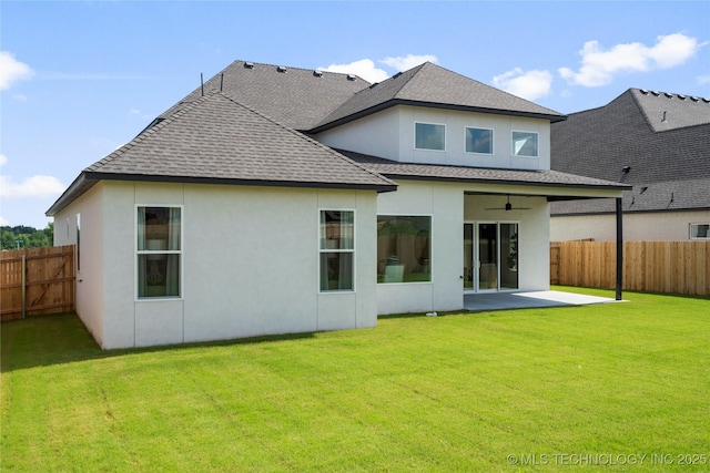 back of house featuring a ceiling fan, a patio area, a fenced backyard, and roof with shingles