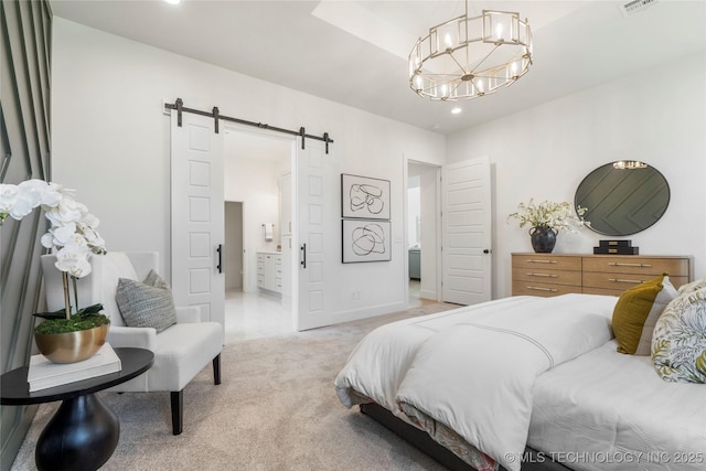 bedroom featuring recessed lighting, an inviting chandelier, connected bathroom, a barn door, and light colored carpet