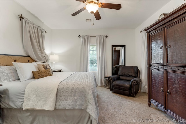 bedroom featuring light colored carpet, ceiling fan, and visible vents