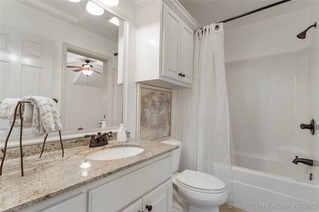 bathroom with vanity, shower / bathtub combination with curtain, toilet, and ceiling fan