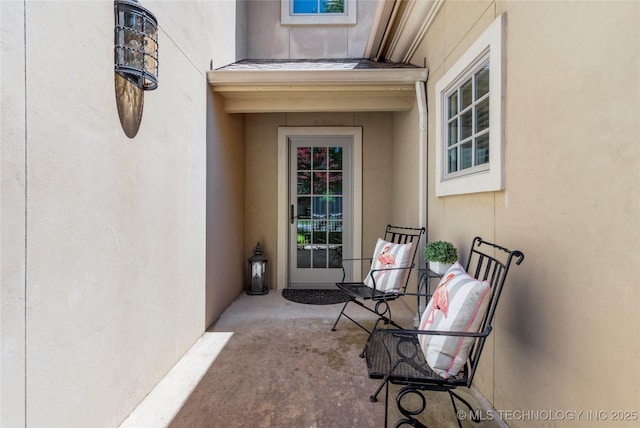 view of exterior entry with stucco siding