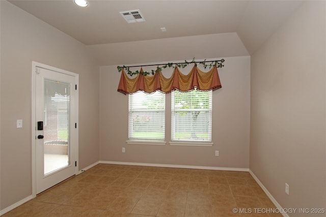 unfurnished dining area featuring recessed lighting, light tile patterned flooring, visible vents, baseboards, and lofted ceiling