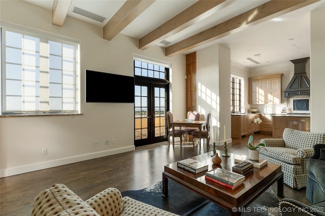 living area featuring visible vents, baseboards, dark wood-type flooring, and beam ceiling