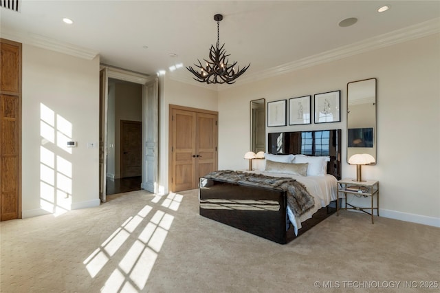 bedroom featuring crown molding, a closet, baseboards, light colored carpet, and a chandelier