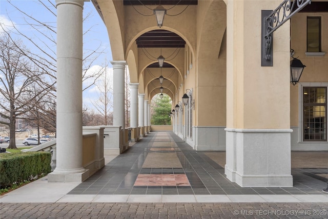entrance to property with stucco siding