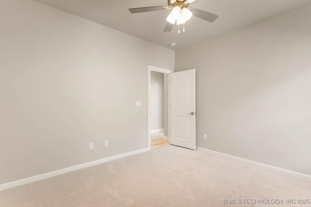 7905 N 146th E Ave, Owasso, OK 74055 - unfurnished room with baseboards, a ceiling fan, and light carpet
