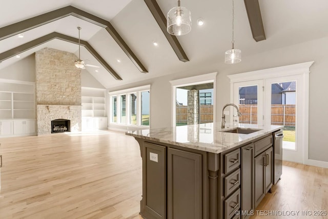7905 N 146th E Ave, Owasso, OK 74055 - kitchen featuring ceiling fan, a wealth of natural light, a sink, and light wood finished floors