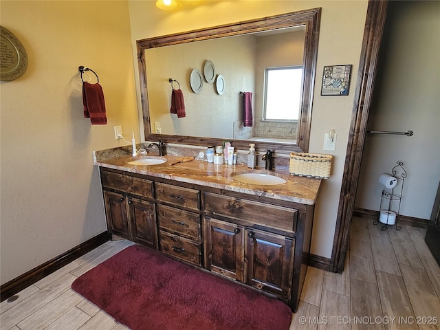 2267 Krebs Lk, Mcalester, OK 74501 - bathroom featuring wood finished floors, double vanity, and baseboards