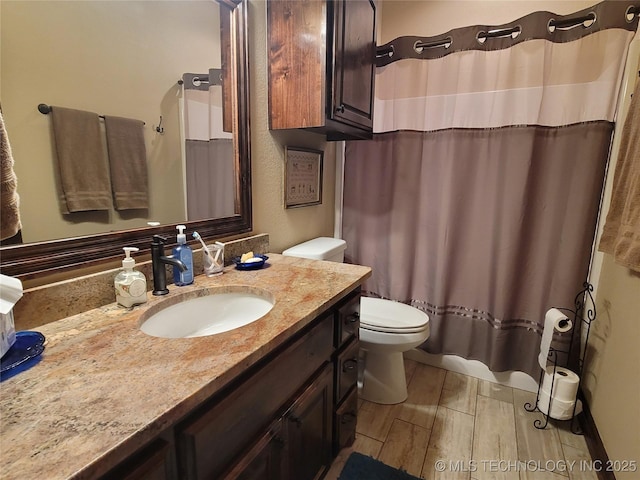 2267 Krebs Lk, Mcalester, OK 74501 - full bath with toilet, vanity, wood finished floors, and a shower with curtain