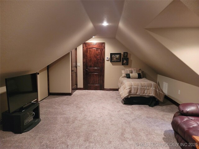 2267 Krebs Lk, Mcalester, OK 74501 - carpeted bedroom featuring lofted ceiling and baseboards