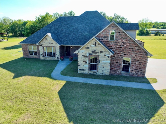 2267 Krebs Lk, Mcalester, OK 74501 - view of front of home with a front lawn, stone siding, a shingled roof, and brick siding