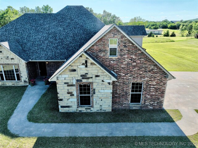 2267 Krebs Lk, Mcalester, OK 74501 - view of front of home with stone siding and a front lawn