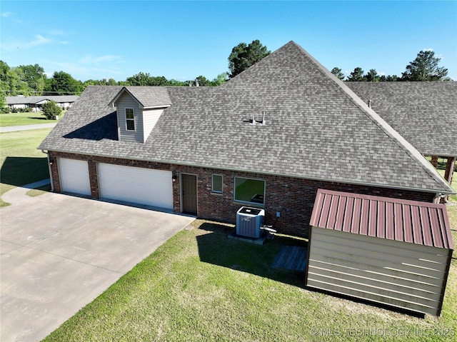 2267 Krebs Lk, Mcalester, OK 74501 - view of front of home with central air condition unit, a shingled roof, and brick siding