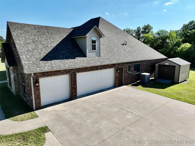 2267 Krebs Lk, Mcalester, OK 74501 - view of home's exterior with cooling unit, brick siding, a shingled roof, and a garage