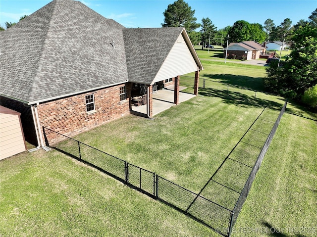 2267 Krebs Lk, Mcalester, OK 74501 - view of home's exterior featuring roof with shingles, brick siding, and a patio area