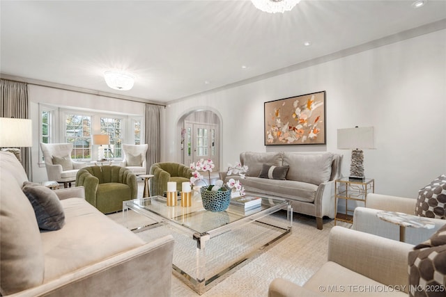 living area with plenty of natural light, arched walkways, wood finished floors, and recessed lighting