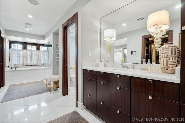 bathroom with recessed lighting, vanity, toilet, and visible vents