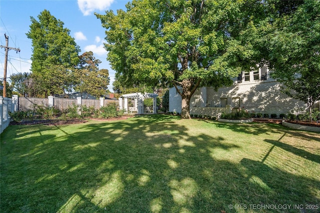 view of yard featuring a fenced backyard and a pergola