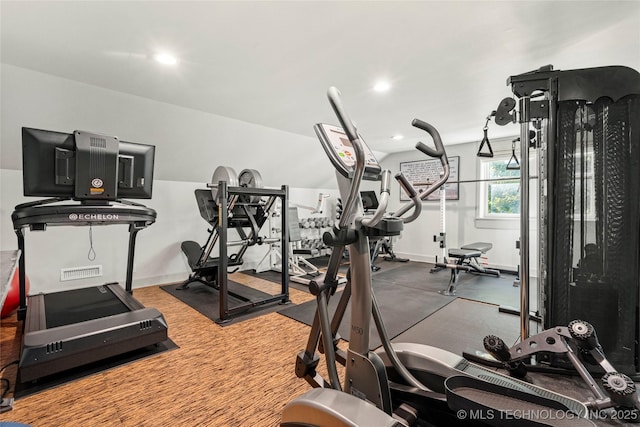 workout area featuring recessed lighting and visible vents