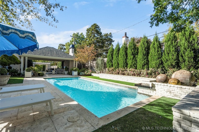 pool featuring a patio, a gazebo, and outdoor lounge area