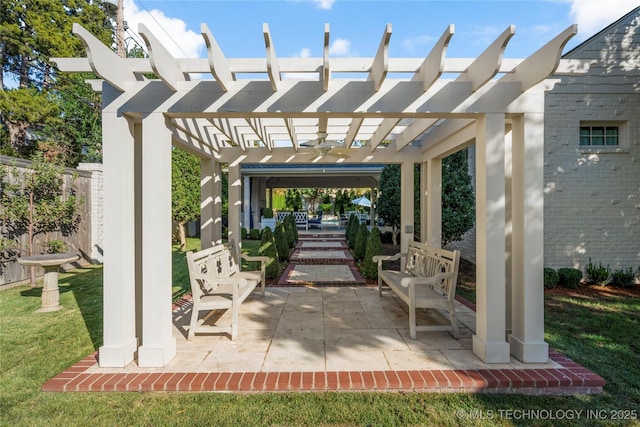 view of patio featuring a pergola and fence