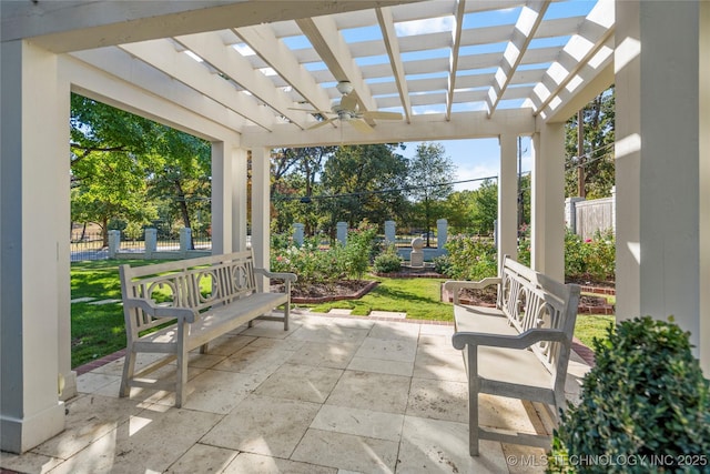 view of patio / terrace with fence, a ceiling fan, and a pergola