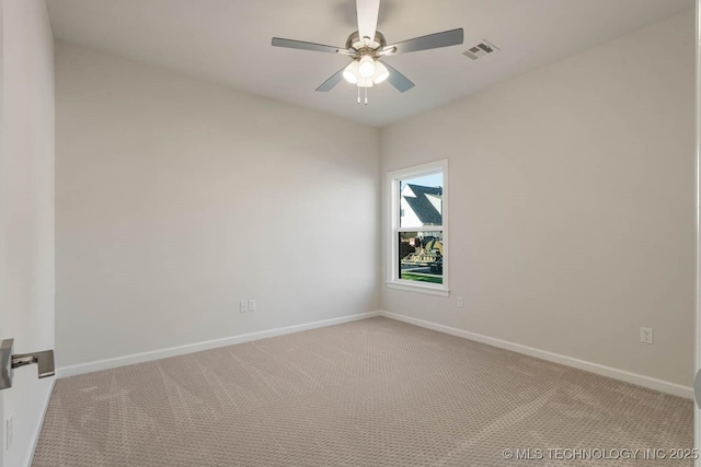 empty room with a ceiling fan, baseboards, visible vents, and light carpet