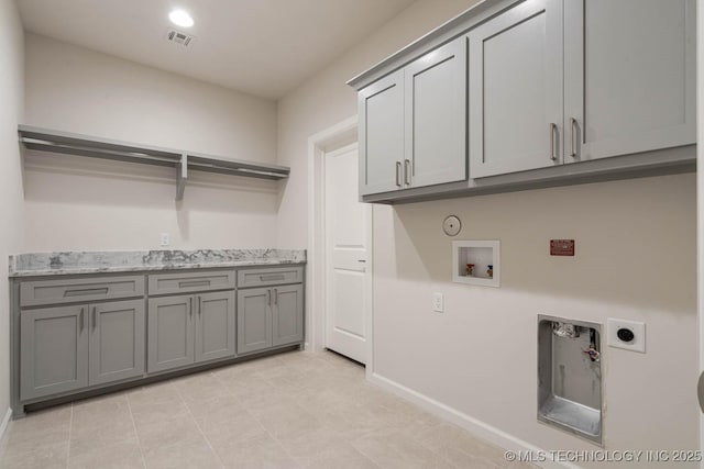 laundry room with visible vents, baseboards, hookup for an electric dryer, cabinet space, and hookup for a gas dryer