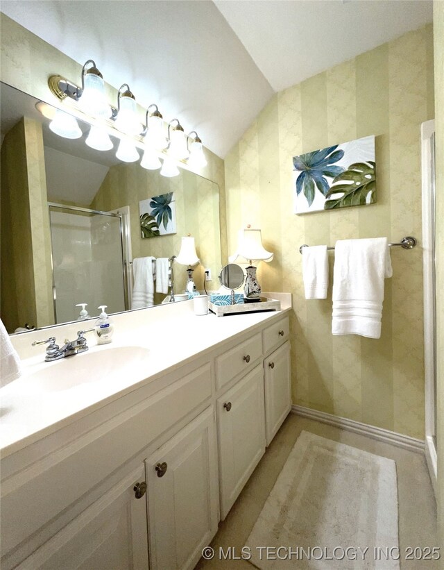 5730 Rolling Oaks Dr, Muskogee, OK 74401 - full bathroom featuring vanity, baseboards, a stall shower, and lofted ceiling