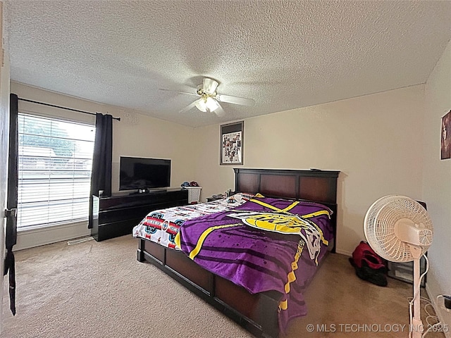 1112 N Hickory Ct, Broken Arrow, OK 74012 - carpeted bedroom with a textured ceiling and ceiling fan