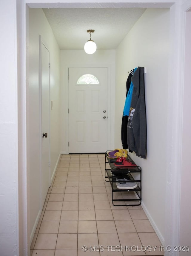 1112 N Hickory Ct, Broken Arrow, OK 74012 - doorway featuring light tile patterned floors and baseboards